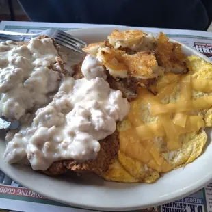 Country fried steak, scrbled eggs wirh cheese,  home fries