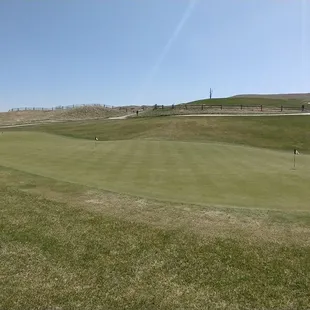 Putting green behind clubhouse