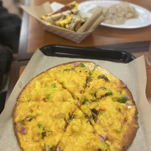 a pizza with cheese and vegetables
