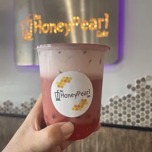 Strawberry milk tea with jellies and popping boba.