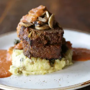 a plate of food on a wooden table