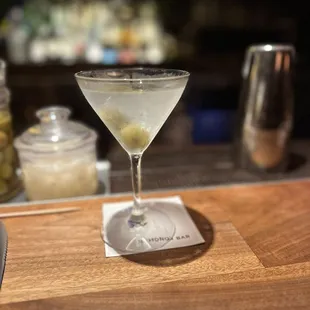 a martini with olives in it