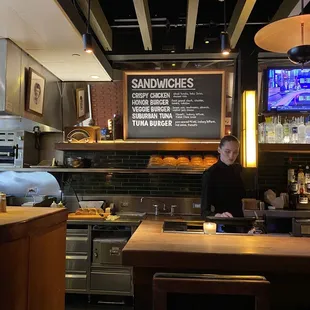 a woman behind the counter