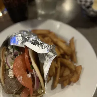 a sandwich and french fries on a plate