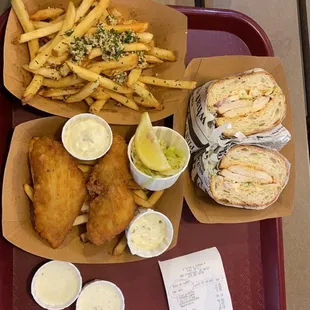garlic fries, fish and chips, grilled chicken sourdough sandwich