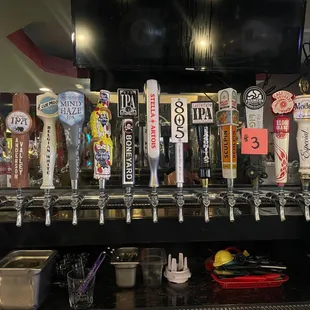 a row of beer taps