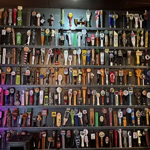 a wall of beer taps