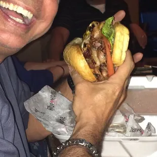 a man holding a sandwich