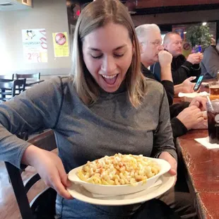 a woman holding a plate of food