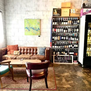 a couch, coffee table, and refrigerator