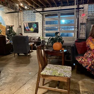 a living room with a couch, chair, and a table