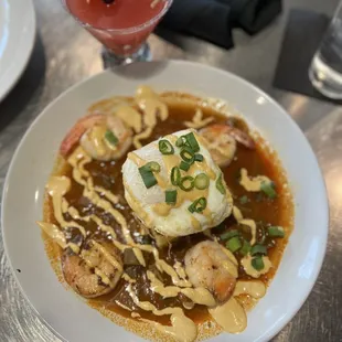 a bowl of soup and a drink