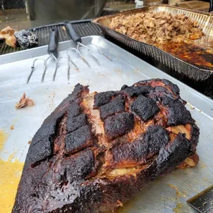 Bone-In Pork Shoulder rubbed with our special house rub, and slow smoked for 17 hours. It is juicy, smokey, and tasty.