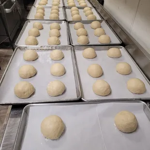 We make our own brioche buns using fresh ingredients like whole milk, water, yeast, butter, flour, salt, eggs, and a little sugar.