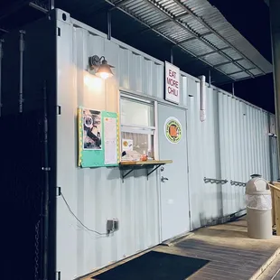 Love the recycled shipping container as the kitchen