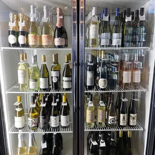 White wine fridge. Bottles are available for here and to-go.