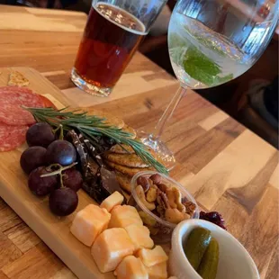 Charcuterie board, beer and mojito