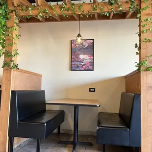 a table and two chairs in a restaurant