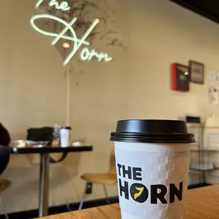 a cup of coffee on a table