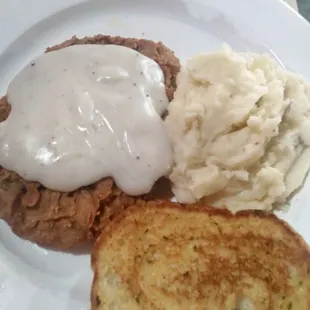 Chicken fried steak, mashed potatoes, garlic bread