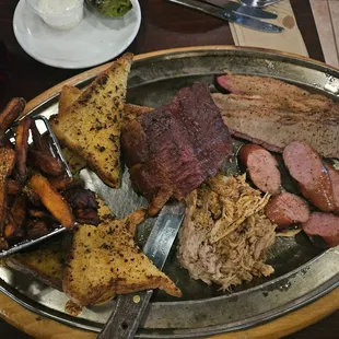 Sampler was massive. Sadly the pork belly appetizers filled us up before the main event arrived. Sweet potato fries melts in your mouth.