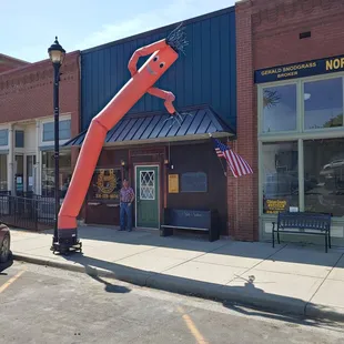 a giant red crane in front of the restaurant