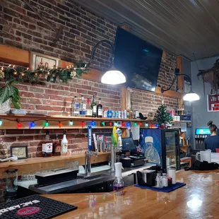 a bar with a brick wall