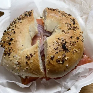 Everything bagel with smoked salmon, chive cream cheese, cucumber, onion, &amp; tomato