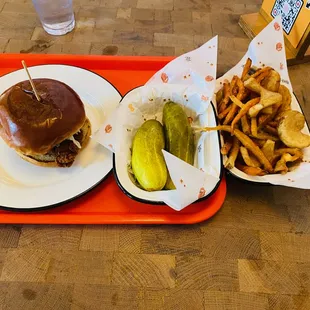 a sandwich and fries on a tray