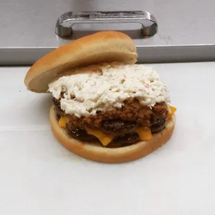 Double chili cheese burger with slaw.