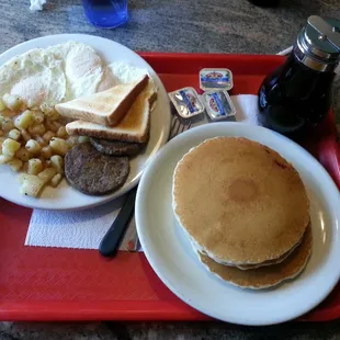 Breakfast platter - 3 eggs, 3 pancakes, 2 toasts, potatoes, and 2 sausage patties (or 3 bacon strips) all for $6.49 + tax.