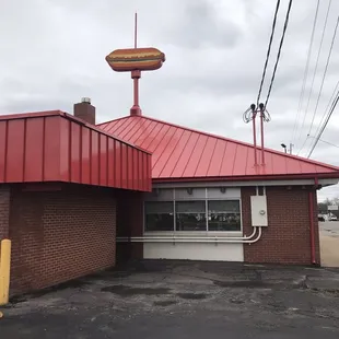a hot dog on top of the building