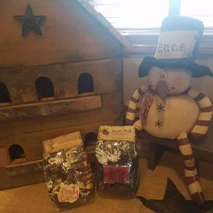 a snowman and a birdhouse