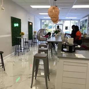 people sitting at tables in a restaurant