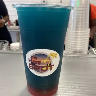 a plastic cup with a drink in it