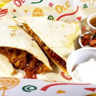 a burrito with a side of salsa