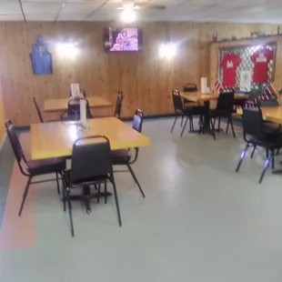 Dining area with tv and jerseys