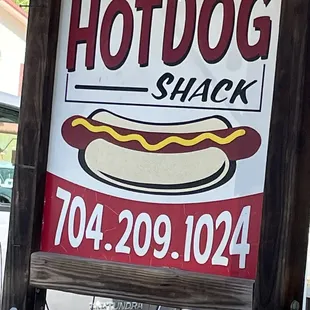 a sign for the hotdog shack