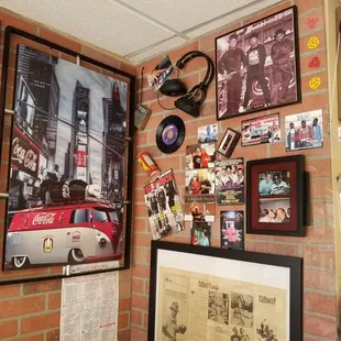 a brick wall with a lot of memorabilia on it