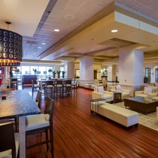 Renovated and expanded hotel lobby offers communal seating and complimentary WIFI.