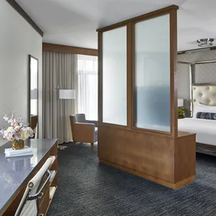 Our Junior Suite includes a separate sitting area and work desk, as well as a plush king-size deluxe pillowtop bed.