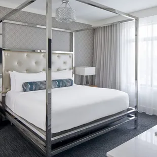 The Supreme Suite overlooks a private courtyard and features a luxurious living area and spacious bathroom.