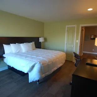 King bed with flooring made from Recycled plastic.  Looks like wood but it's not.