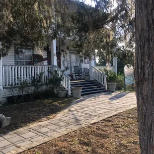 Outside front- there may be a sign at the front door to go around back