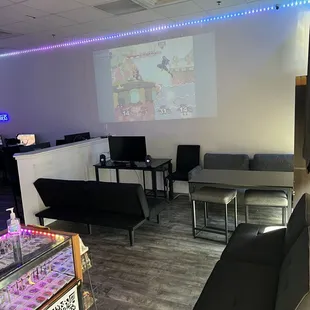 Front lobby area that has our projector playing live esports events or replays.