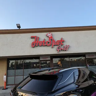 a car parked in front of the restaurant