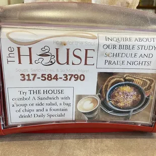 a red toaster with a sign on it