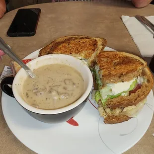 Cream of mushroom soup with grilled chicken breast sandwich.