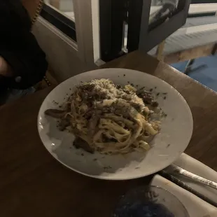 a plate of spaghetti and meat