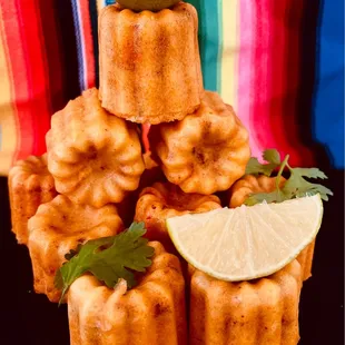 a stack of cakes with lime wedges